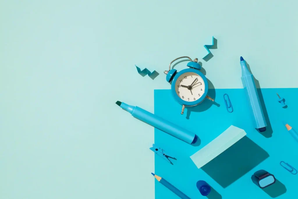 clock and stationary on a blue background